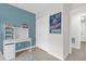 Bedroom featuring blue accent wall with adjacent working space, closets for storage, and tile flooring at 339 Chinaberry Ave, Oviedo, FL 32765