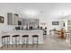 Modern kitchen features stainless steel appliances, a breakfast bar, and a cozy dining area at 339 Chinaberry Ave, Oviedo, FL 32765