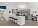 Modern kitchen features stainless steel appliances, a breakfast bar, and gray cabinetry at 339 Chinaberry Ave, Oviedo, FL 32765