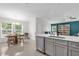 Open concept living space features a kitchen, dining area, and living room at 339 Chinaberry Ave, Oviedo, FL 32765