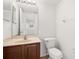 Bathroom featuring a vanity with double sinks, a large mirror, and ample counter space at 442 Churchill Ct, Kissimmee, FL 34759
