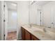 Bathroom with double sinks, a large mirror, and a connecting door to the toilet and shower at 442 Churchill Ct, Kissimmee, FL 34759