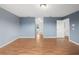 Spacious bedroom with blue walls and hardwood floors at 442 Churchill Ct, Kissimmee, FL 34759