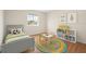 Charming bedroom featuring a cozy bed and colorful play area with ample natural light at 442 Churchill Ct, Kissimmee, FL 34759