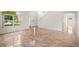 Spacious living room showcasing tile flooring, white walls, and large windows allowing for natural light at 442 Churchill Ct, Kissimmee, FL 34759
