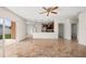Open-concept living room connects to kitchen with stainless steel appliances at 442 Churchill Ct, Kissimmee, FL 34759