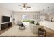 Comfortable living room with neutral tones, with a beige sofa, a patterned rug, and a sliding glass door at 442 Churchill Ct, Kissimmee, FL 34759