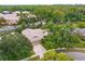 Aerial view of a home with mature trees and lush landscaping in a quiet neighborhood at 4739 Indian Gap Dr, Orlando, FL 32812