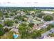 An aerial view shows a property outlined in yellow with a large pool and mature tree coverage at 4739 Indian Gap Dr, Orlando, FL 32812