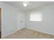 Neat bedroom with neutral carpet, a ceiling fan, and a double door closet at 4739 Indian Gap Dr, Orlando, FL 32812