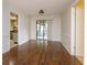 Dining room with wood floors and natural light; the kitchen can be seen in the background at 4739 Indian Gap Dr, Orlando, FL 32812