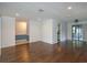 Bright open-plan living space with hardwood flooring and light colored walls at 4739 Indian Gap Dr, Orlando, FL 32812