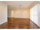 Spacious living room featuring wood floors, natural light, and neutral paint at 4739 Indian Gap Dr, Orlando, FL 32812