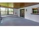 The cozy sunroom features wood-paneled ceilings and lots of natural light streaming in from multiple windows at 4739 Indian Gap Dr, Orlando, FL 32812