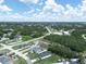 Aerial view of the neighborhood with residential homes and surrounding greenery at 527 Rio Grande Dr, Poinciana, FL 34759