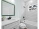 Modern bathroom with white cabinets, quartz countertop, and neutral paint at 527 Rio Grande Dr, Poinciana, FL 34759