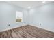 Empty bedroom featuring a modern plank floors and a window with natural light at 527 Rio Grande Dr, Poinciana, FL 34759