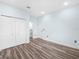 Spacious room with plank floors, neutral paint, and attached bathroom at 527 Rio Grande Dr, Poinciana, FL 34759