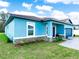 Lovely single-Gathering home featuring a covered entryway, well-maintained lawn, and an attached two-car garage at 527 Rio Grande Dr, Poinciana, FL 34759