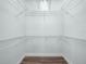 Spacious walk-in closet featuring multiple wire shelves for optimal organization and storage at 527 Rio Grande Dr, Poinciana, FL 34759