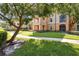 Well-maintained building exterior with lush landscaping, sidewalks and easy access to parking at 5467 Vineland Rd # 6110, Orlando, FL 32811