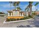 Elegant entrance to Cypress Fairway residences with manicured landscaping and a welcoming gate at 5467 Vineland Rd # 6110, Orlando, FL 32811