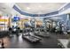 Modern gym featuring treadmills, weight machines, and mounted televisions for an engaging workout experience at 5467 Vineland Rd # 6110, Orlando, FL 32811
