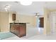 Stylish kitchen with a breakfast bar, sleek countertops, contemporary lighting, and an adjacent living area at 5467 Vineland Rd # 6110, Orlando, FL 32811