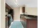 Stylish kitchen featuring modern appliances, dark wood cabinets, sleek countertops, and ample storage space at 5467 Vineland Rd # 6110, Orlando, FL 32811