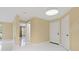 Bright, airy living room featuring crisp white tile floors, neutral paint, modern lighting fixtures, and ample natural light at 5467 Vineland Rd # 6110, Orlando, FL 32811