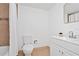Well-lit bathroom featuring a shower-tub combo and a vanity with a sink at 6052 Village Cir # 6052, Orlando, FL 32822