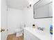 Clean and bright bathroom with a modern vanity, toilet, and tiled floor at 6052 Village Cir # 6052, Orlando, FL 32822