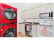 This bright kitchen has modern appliances, cabinets, and counter space at 6052 Village Cir # 6052, Orlando, FL 32822