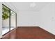 Spacious living room featuring hardwood floors and a sliding glass door at 6052 Village Cir # 6052, Orlando, FL 32822