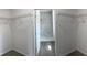 Bright, walk-in closet with white wire shelving, offering ample storage space at 611 Amazon Pl, Kissimmee, FL 34759