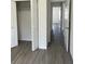 Hallway with neutral gray floors that leads past a closet and into another room at 611 Amazon Pl, Kissimmee, FL 34759
