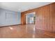 Spacious living room with blue walls, hardwood floors, and a wood accent wall at 641 Jackson St, Eustis, FL 32726