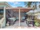Back patio showing cozy seating area under a gazebo, perfect for outdoor relaxation and entertainment at 840 Del Prado Dr, Kissimmee, FL 34758