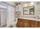 Bathroom featuring vanity with wood cabinets and granite countertop, toilet, and shower/tub combo at 840 Del Prado Dr, Kissimmee, FL 34758