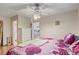 Bedroom view featuring tile floors, a ceiling fan, and a white dresser at 840 Del Prado Dr, Kissimmee, FL 34758