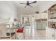Bright dining area featuring tile floors, a modern table setting, and access to the backyard at 840 Del Prado Dr, Kissimmee, FL 34758