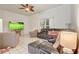 Bright living room with tile flooring, a ceiling fan, and comfortable seating area with recliners at 840 Del Prado Dr, Kissimmee, FL 34758