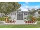 Storage shed surrounded by landscaping, providing practical storage and enhancing the outdoor space at 840 Del Prado Dr, Kissimmee, FL 34758