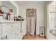 View of the walk-in closet leading to the bathroom, with a dresser on the left at 840 Del Prado Dr, Kissimmee, FL 34758