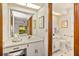Bathroom featuring a vanity, white cabinets, and toilet in separate room at 8988 Angelica Dr, Orlando, FL 32836