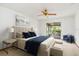 Bedroom featuring neutral decor, king bed, and sliding glass doors to the outside at 8988 Angelica Dr, Orlando, FL 32836