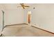 Spacious primary bedroom with neutral carpet, ceiling fan and ample closet space at 8988 Angelica Dr, Orlando, FL 32836