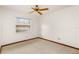 Bedroom featuring a ceiling fan and large window at 8988 Angelica Dr, Orlando, FL 32836