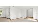 Neutral empty room with light-colored carpet and wood trim at 8988 Angelica Dr, Orlando, FL 32836
