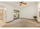 Cozy living area features sliding glass doors leading to the porch, plenty of natural light at 8988 Angelica Dr, Orlando, FL 32836